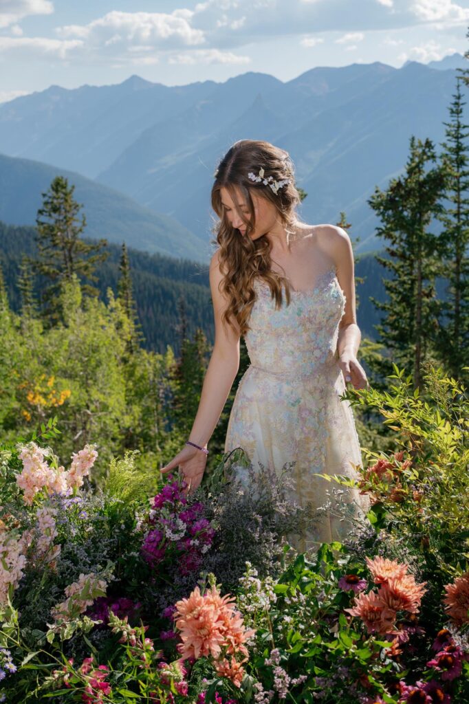 little nell aspen colorado wedding with bride posing among flowers