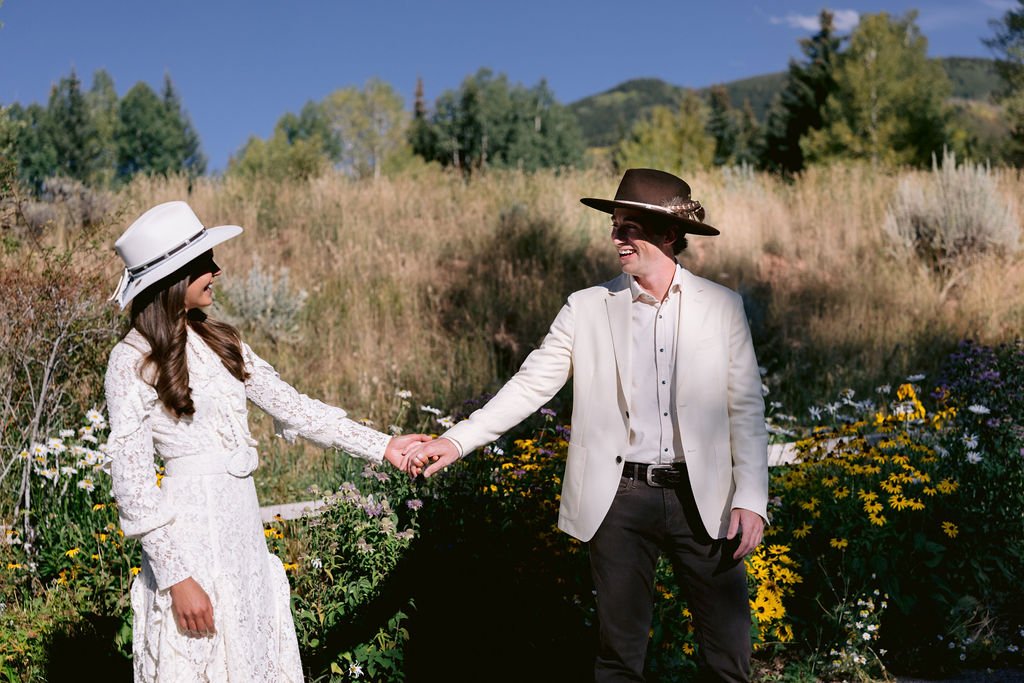 bride and groom lovingly starring at each other during their portrait shoot at their wedding venues in aspen colorado
