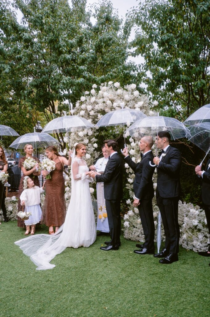bride and groom holding hands during their hotel jerome aspen wedding ceremony