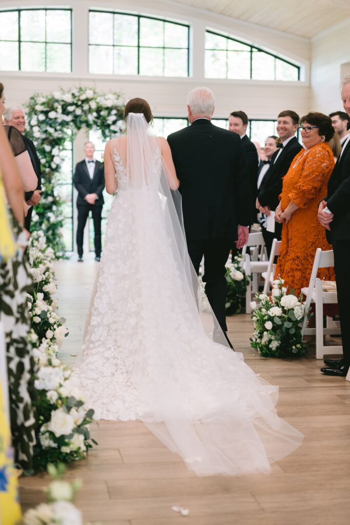 father and bride walking down the aisle during her old edwards inn wedding