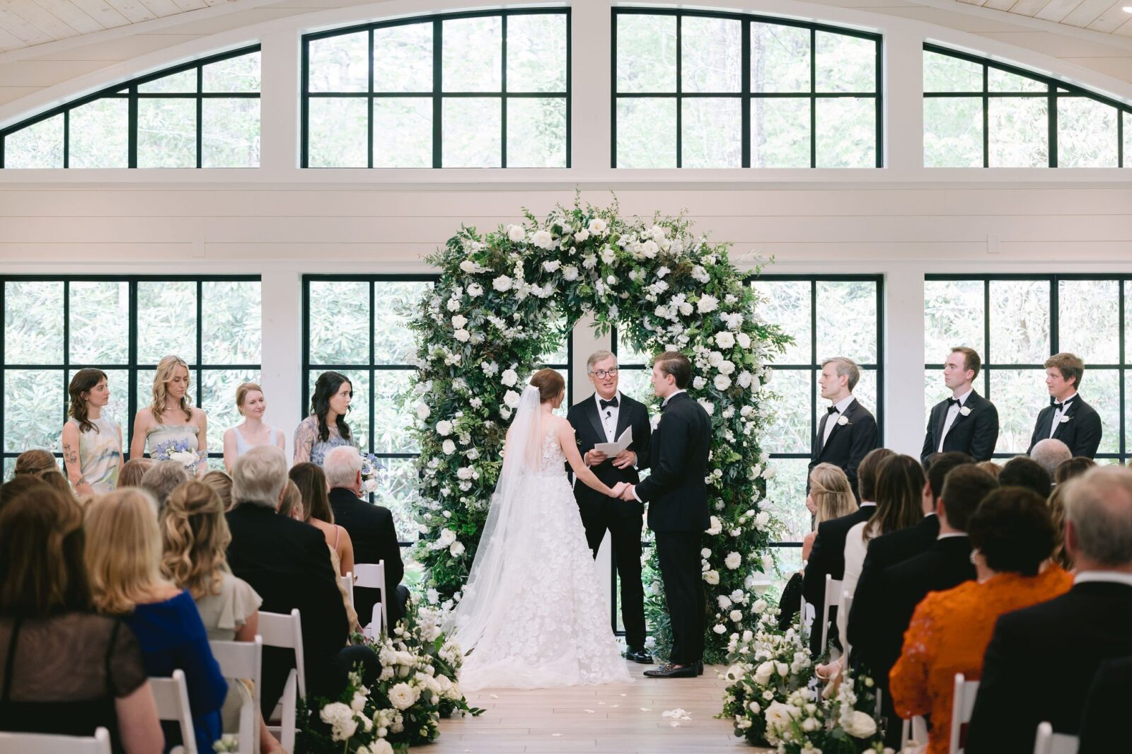 bride and groom exchanging vows during their old edwards inn wedding