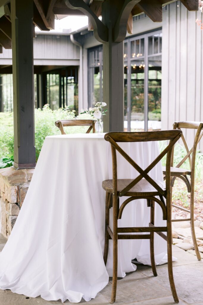 round table draped in white linen inside an old edwards wedding reception venue