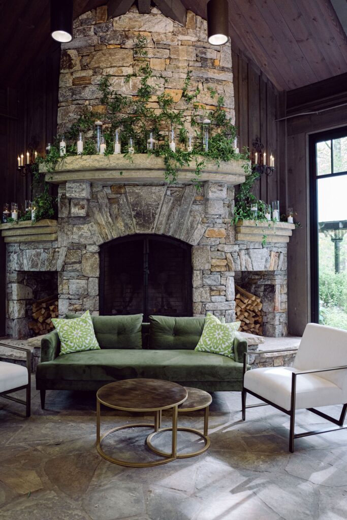 fireplace with a green sofa inside an old edwards inn wedding venue