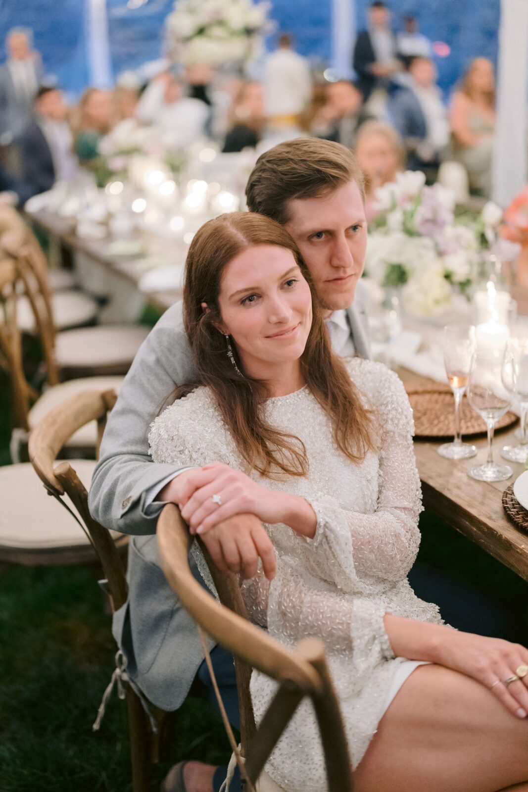 bride and groom lovingly watching a guest deliver a speech at their Piermont Cottage rehearsal dinner at Old Edwards Inn and Spa