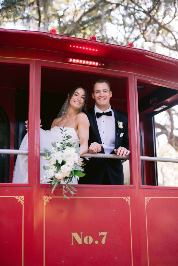 bride and groom posing for a photo before their sea pines resort wedding reception