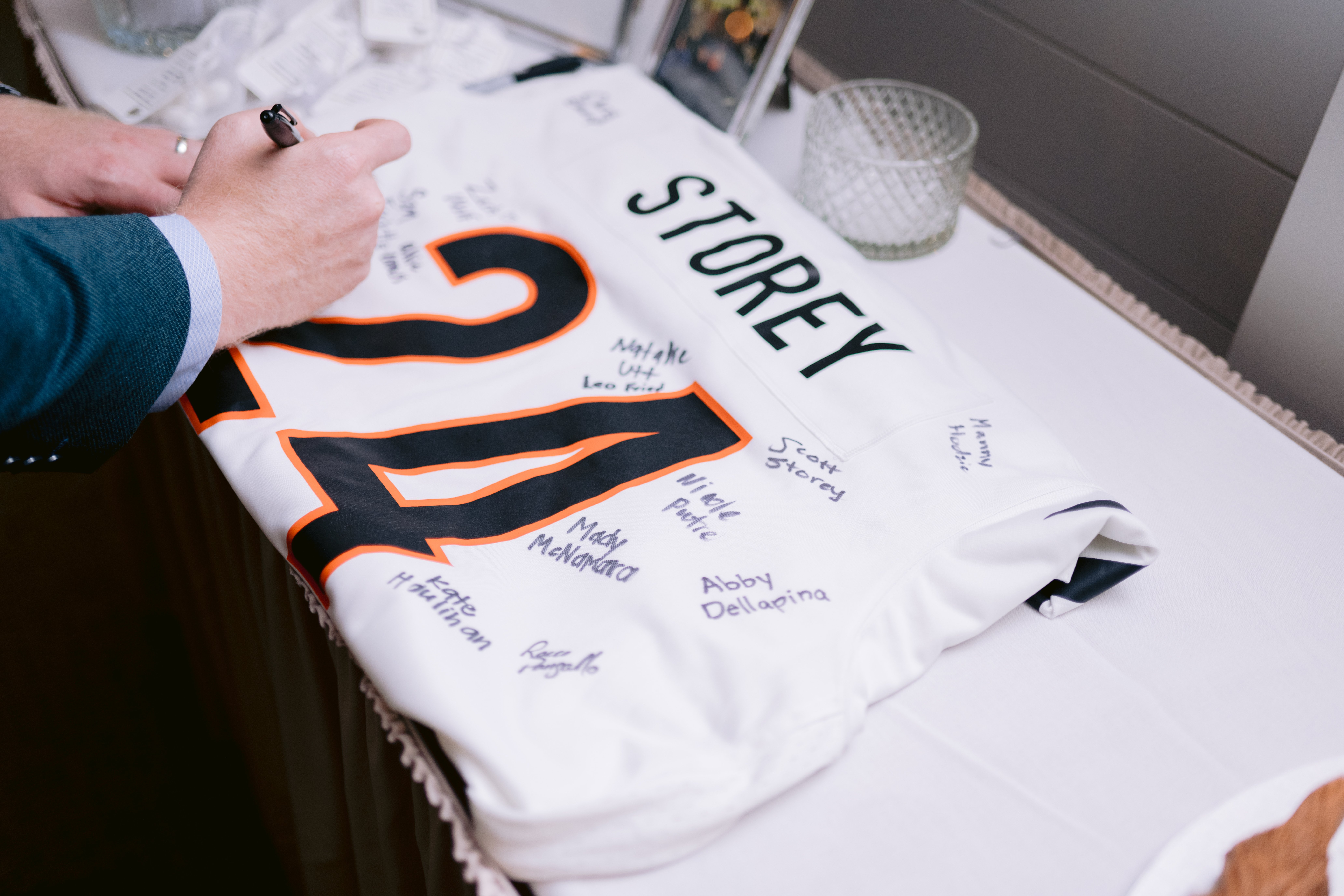 guest signing shirt for a bride and groom at their sea pines wedding