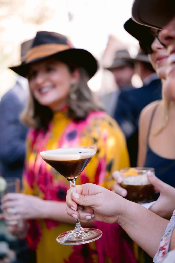 wedding guest drinking an espresso martini at an aspen resort wedding