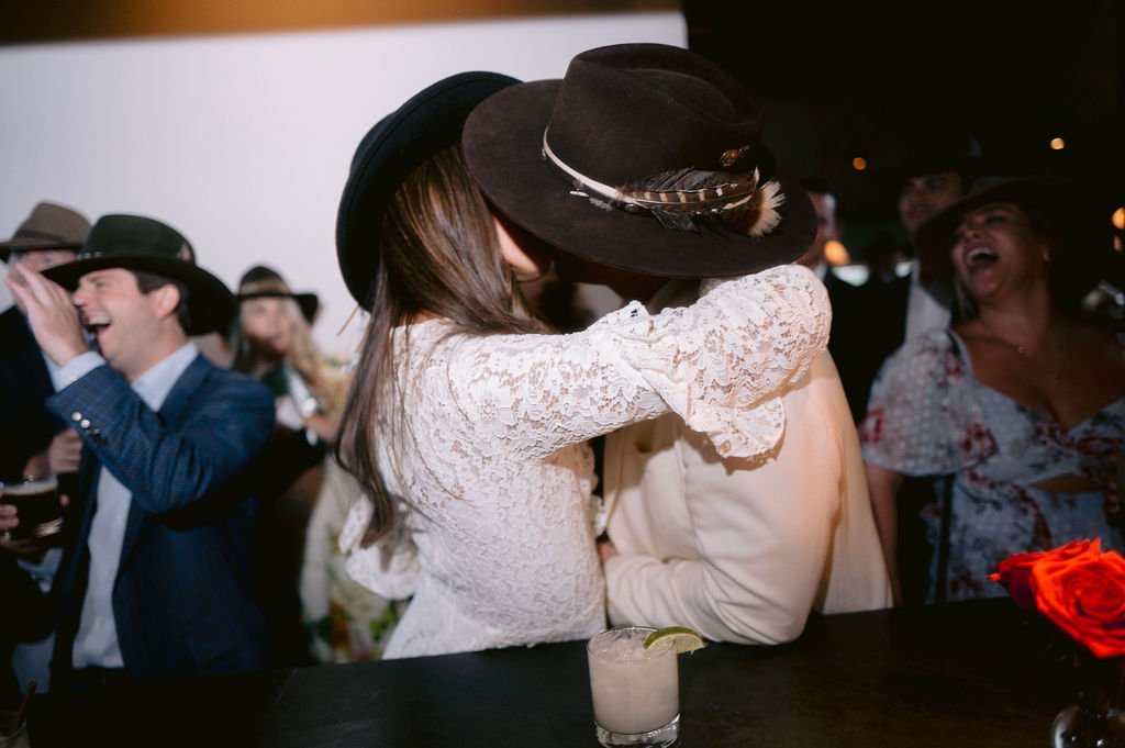bride and groom sharing an unplanned kiss during their aspen meadows wedding