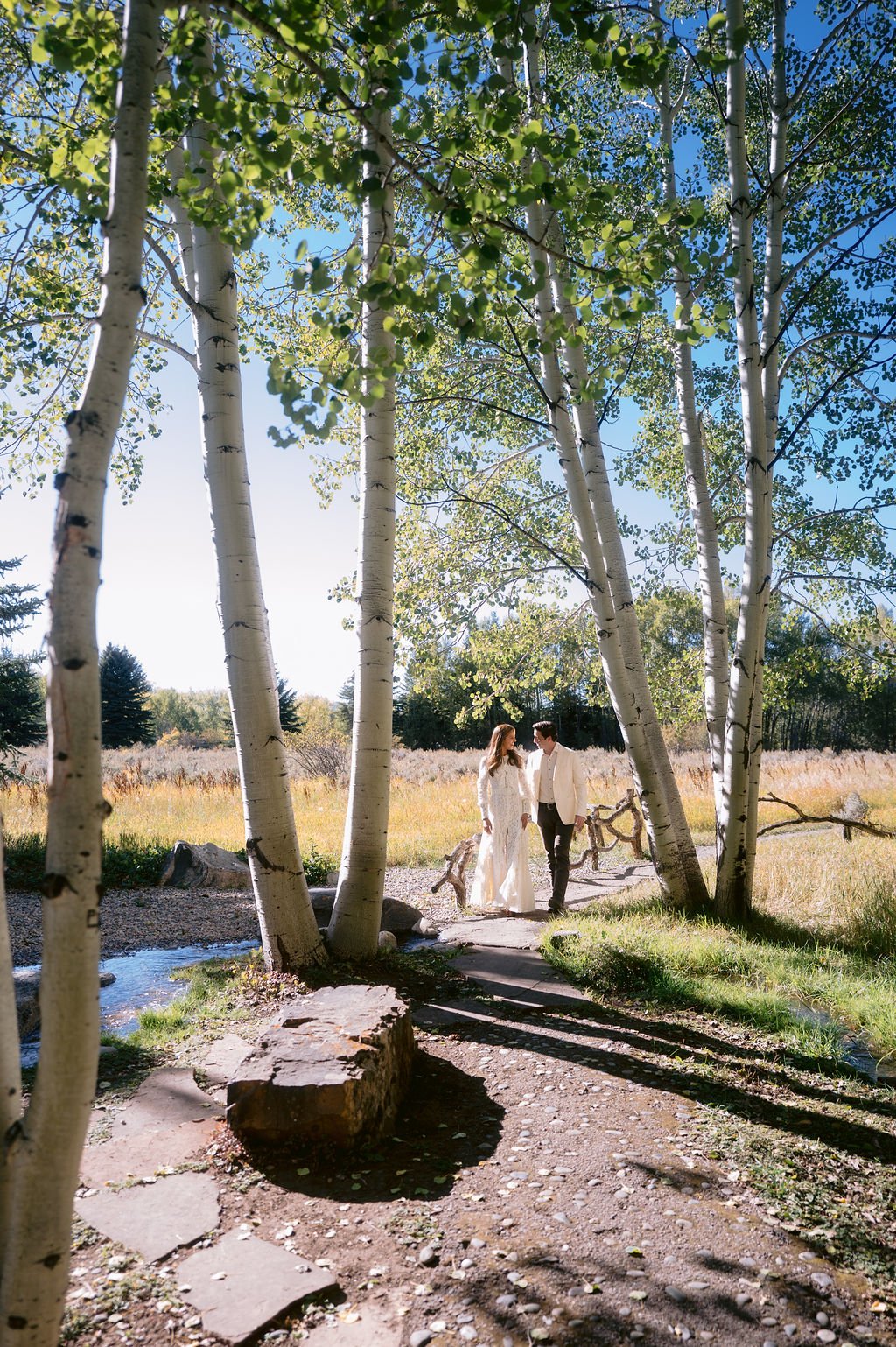bride and groom lovingly staring at each other during their portrait session at their aspen wedding