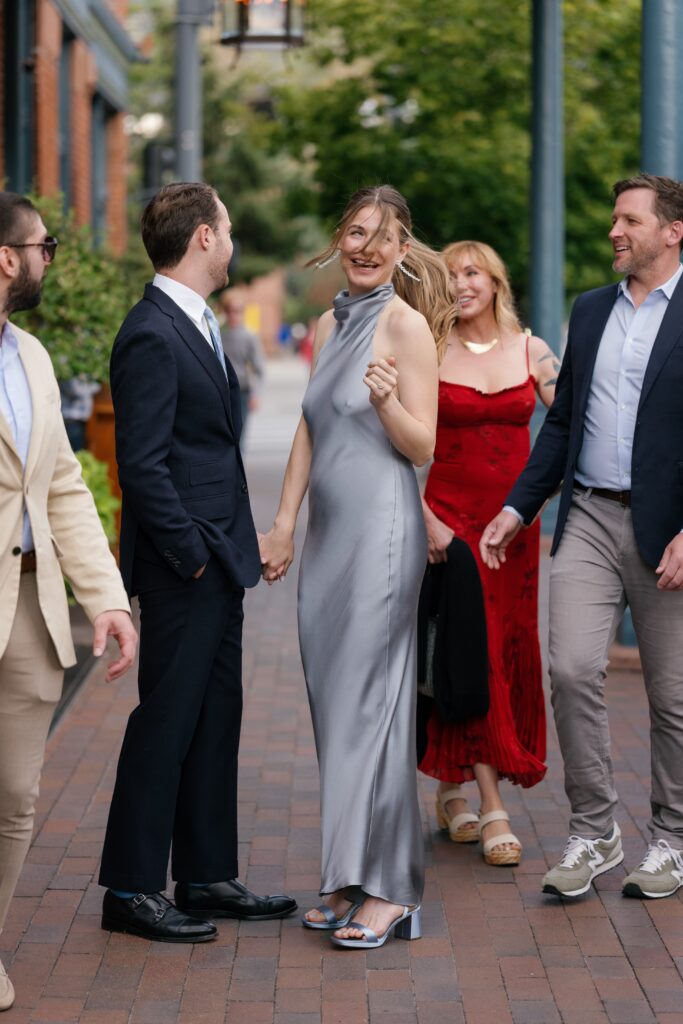 elegant wedding guests celebrating together ahead of a luxury wedding in aspen, capturing the atmosphere of an aspen mountain wedding weekend