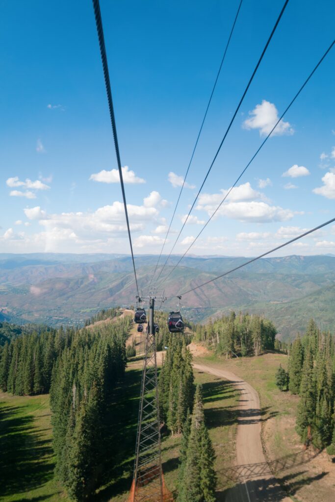aspen mountain gondola ride to a luxury wedding in Aspen Colorado with sweeping alpine views