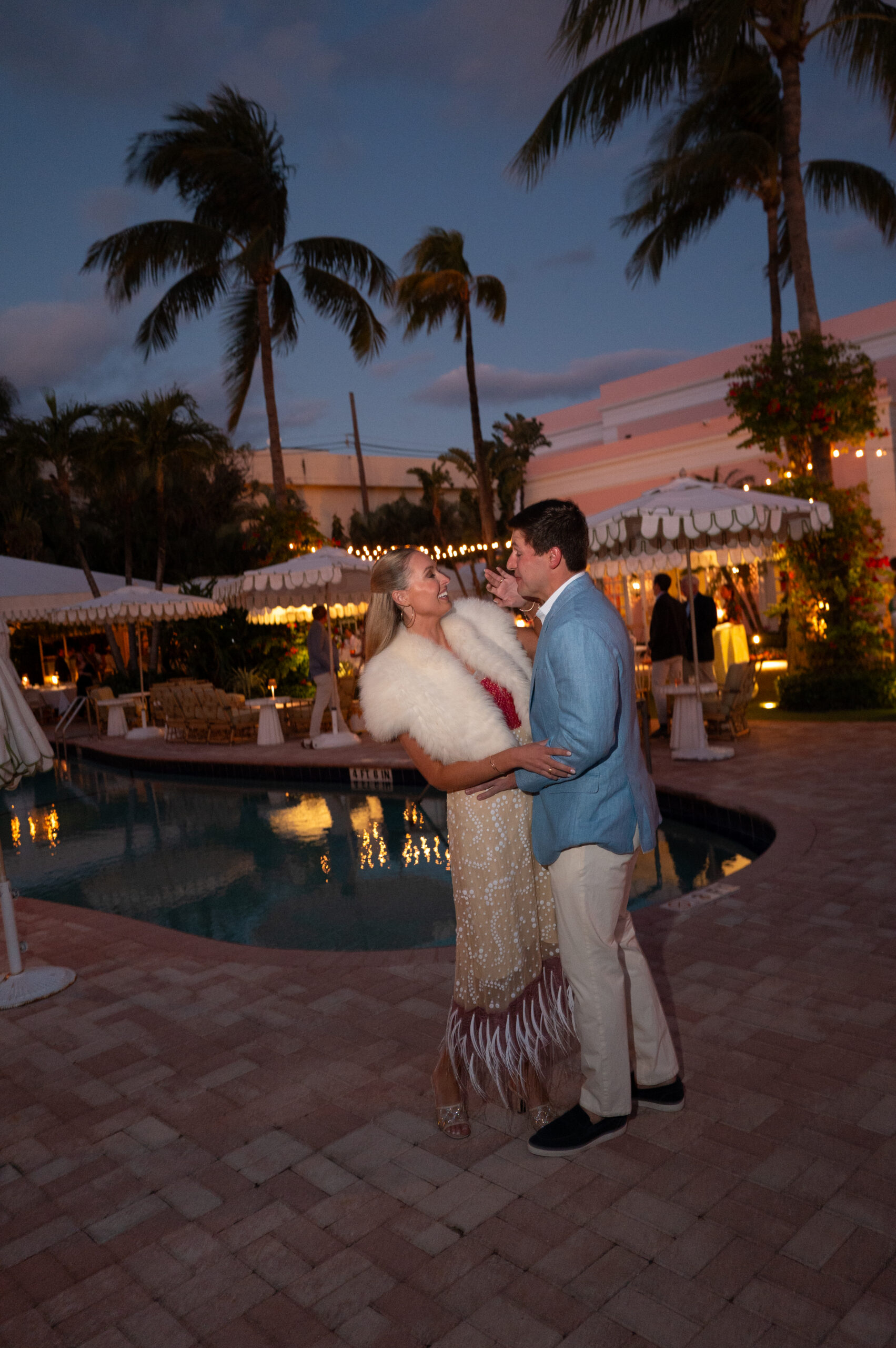 bride and groom sharing an intimate moment outdoors and one of most iconic wedding venues in palm beach, fl, the colony hotel