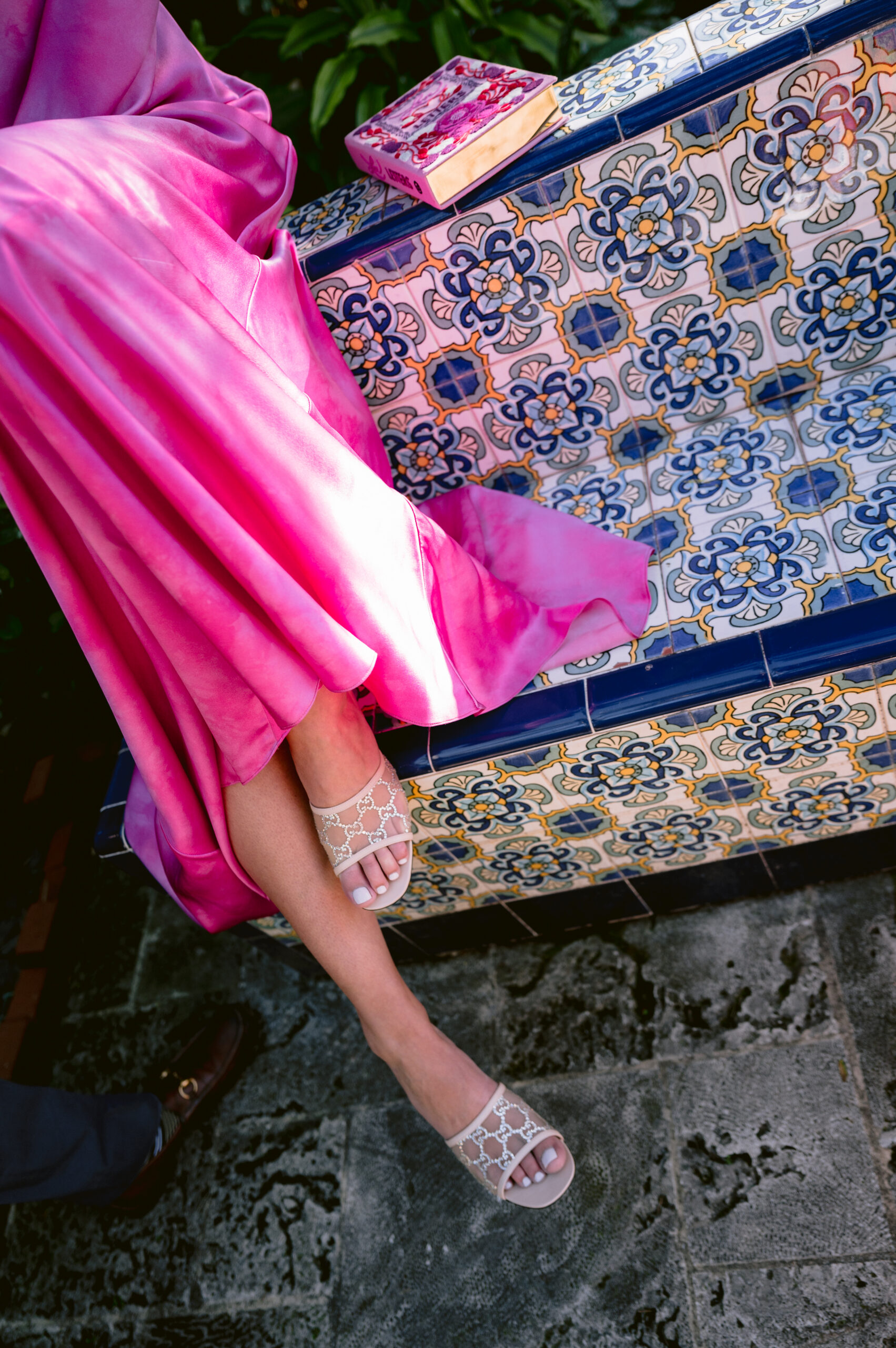 artistic photograph of a bride's pink dress and shoes at the colony hotel, palm beach, fl