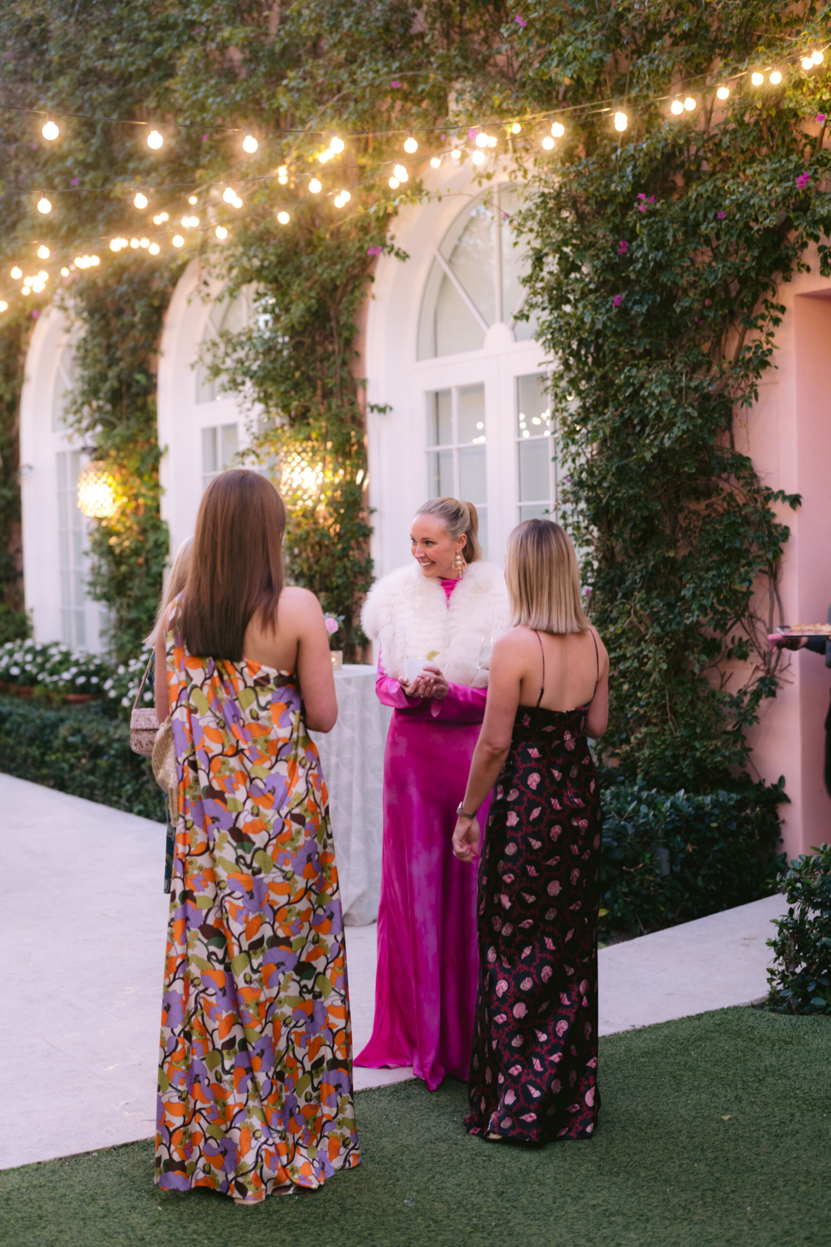 bride mingling with her guests during her welcome party at one of the best wedding venues in palm beach, fl