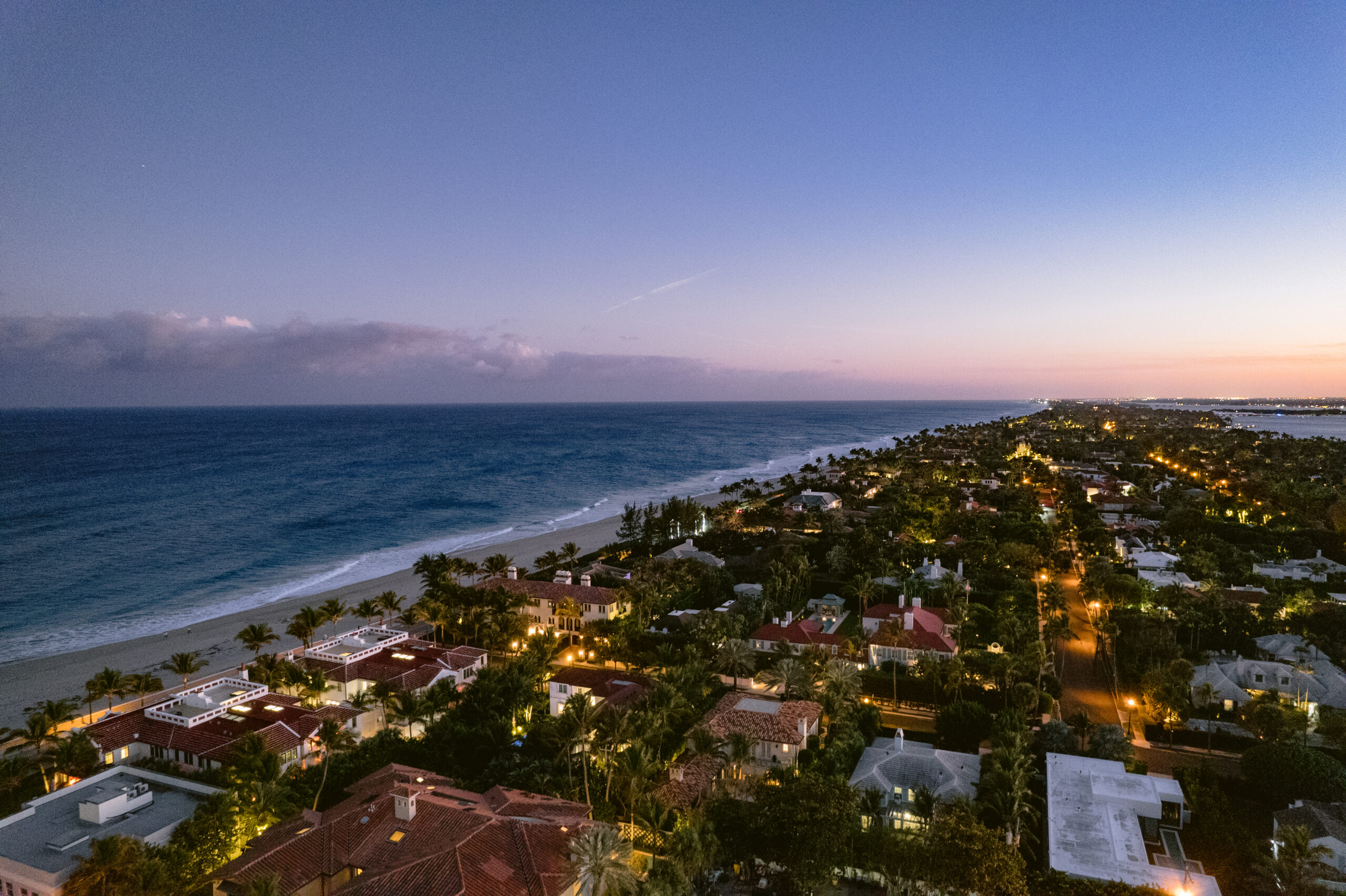 aerial shot of building and the ocean in palm beach, fl