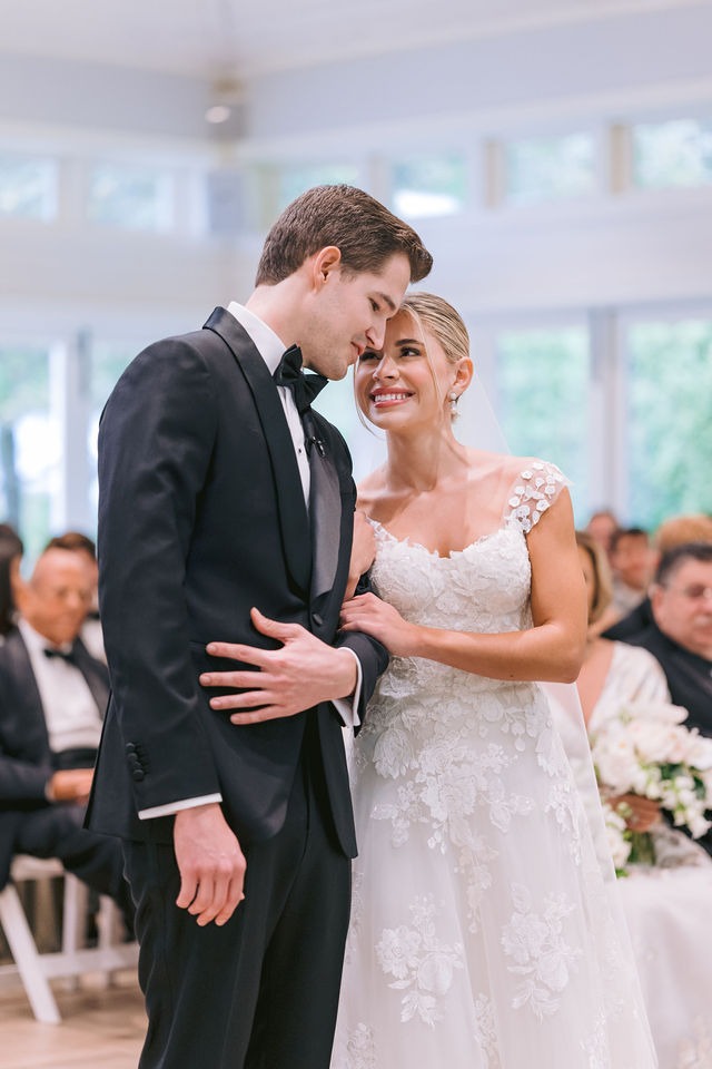 bride and groom lovingly looking at each other during their half-mile farm old edwards wedding ceremony