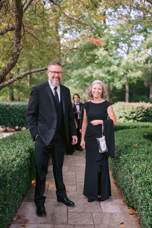 wedding guests moving around on the property of old edwards inn half-mile farm