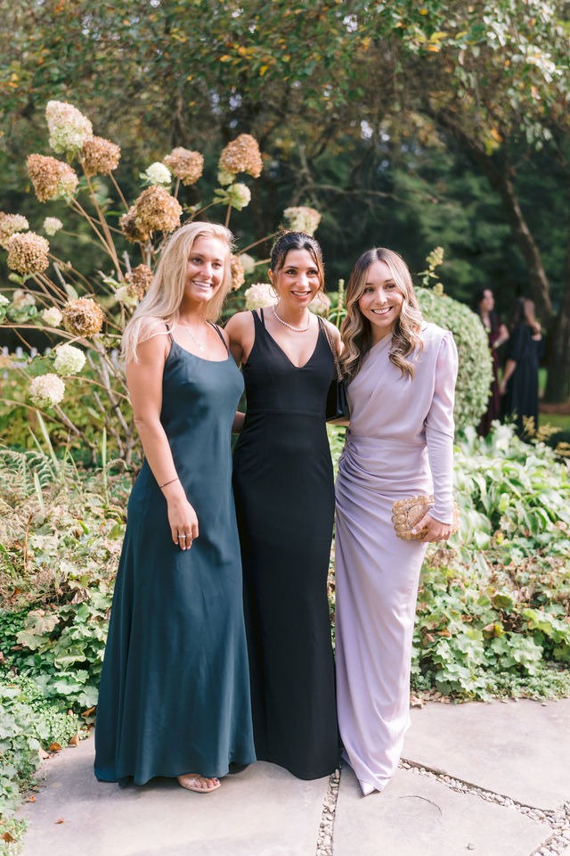 wedding guests posing at a highlands nc wedding venue