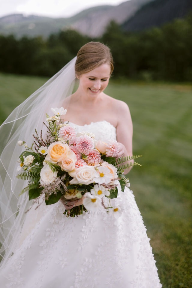portrait of a bride holding her bouquest at a highlands nc wedding venue