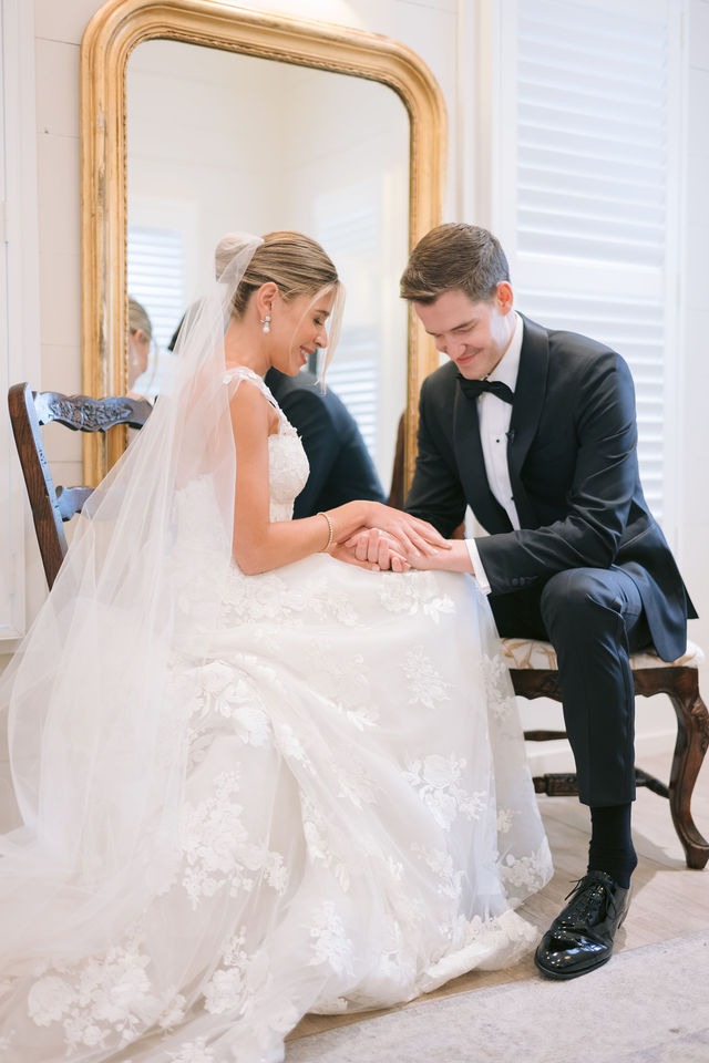bride and groom praying after their wedding reception held at one of the most beautiful wedding venues in highlands nc