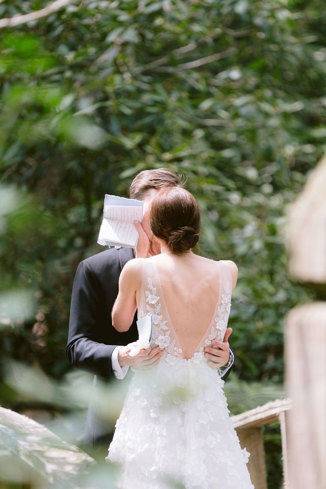 bride wiping away tears during a private vow exchange at a highlands nc wedding venue