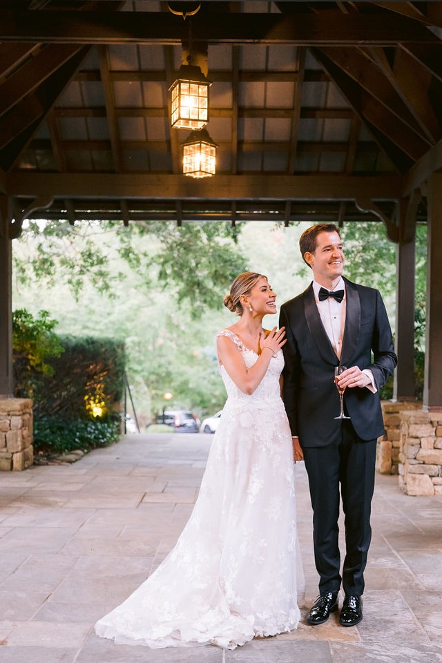 bride and groom walking into their highlands, nc wedding venues, seeing the reception area for the first time