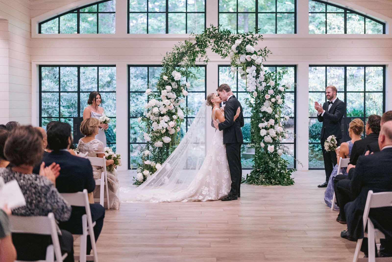 bride and groom sharing their first kiss after getting married at their highlands nc wedding venue