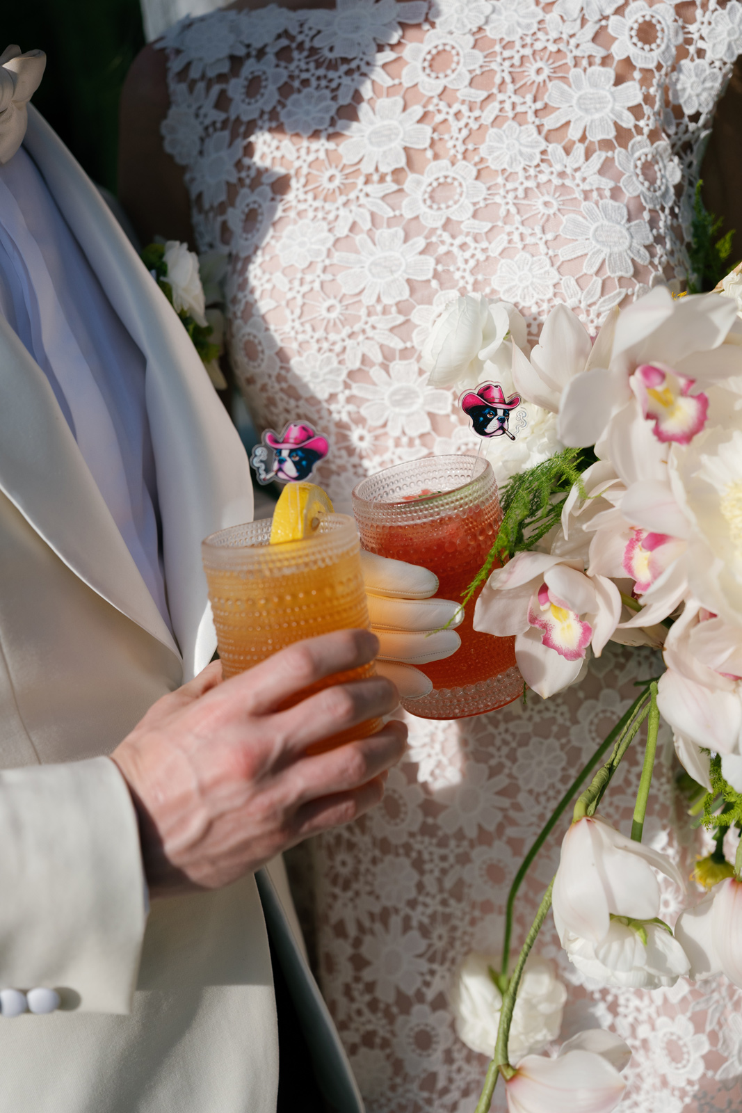 Couple holding their drinks during their wedding at half mile farm old edwards inn
