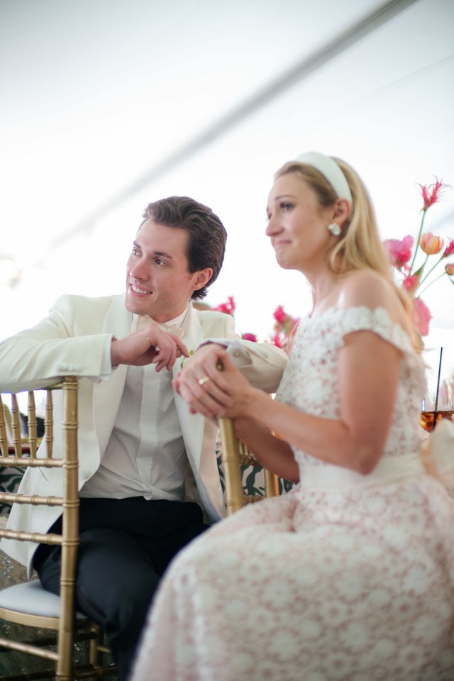 candid portrait of a bride and groom sitting together during their old edwards half mile farm reception