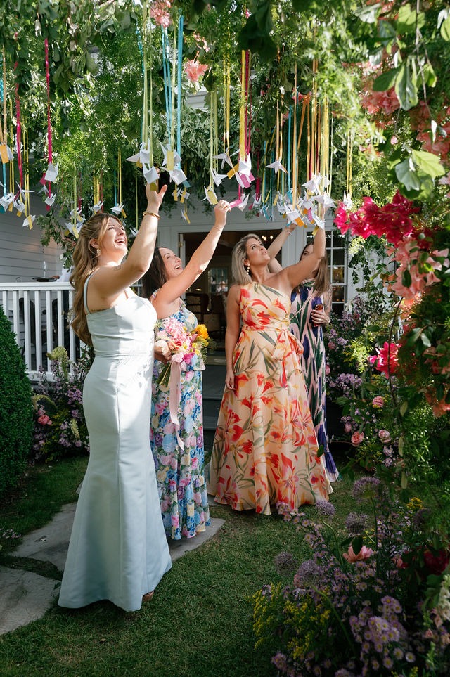 candid photo of wedding guests looking at tree decor during an old edwards half mile file wedding