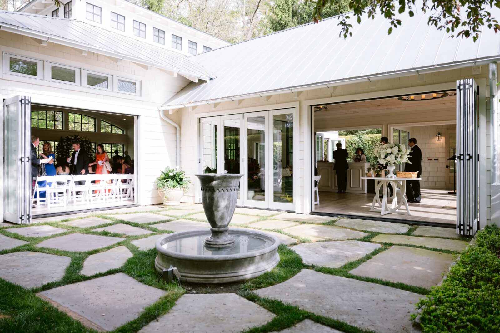 Open-air wedding venue overlooking a stone courtyard with a central fountain.